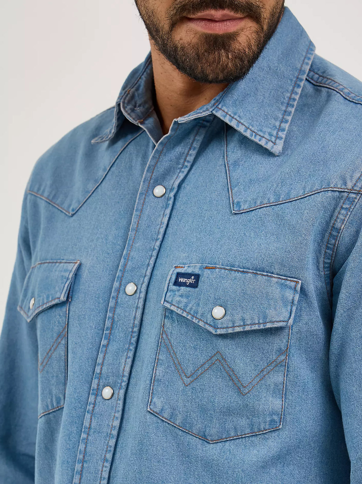 Wrangler Men's Authentic Cowboy Cut work shirt in stonewash denim, featuring classic western styling and durable fabric.