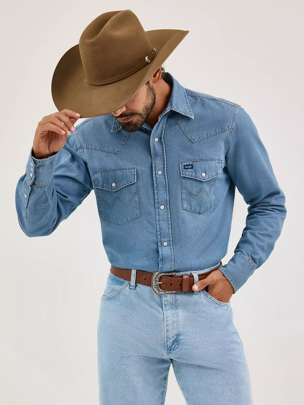 Wrangler Men's Authentic Cowboy Cut Work Shirt in stonewash denim, featuring a classic button-up design and chest pockets.