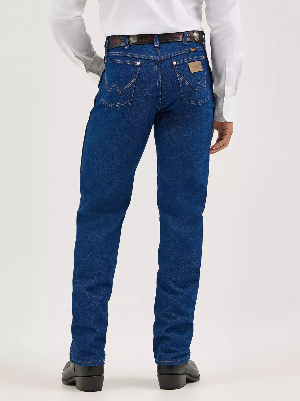 Wrangler Men's Cowboy Cut Original Fit jeans in prewashed indigo denim, featuring classic Western style and durable construction.