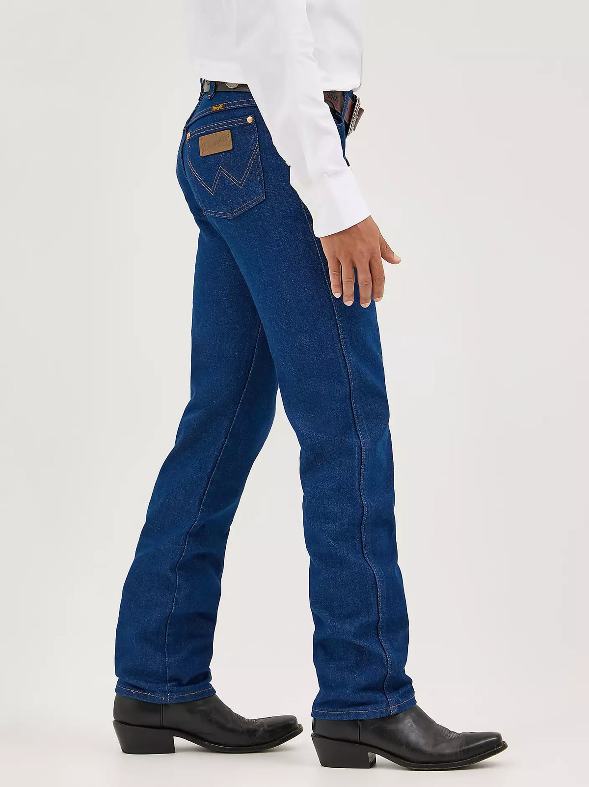 Wrangler Men's Cowboy Cut Original Fit jeans in prewashed indigo denim, displayed on a hanger.