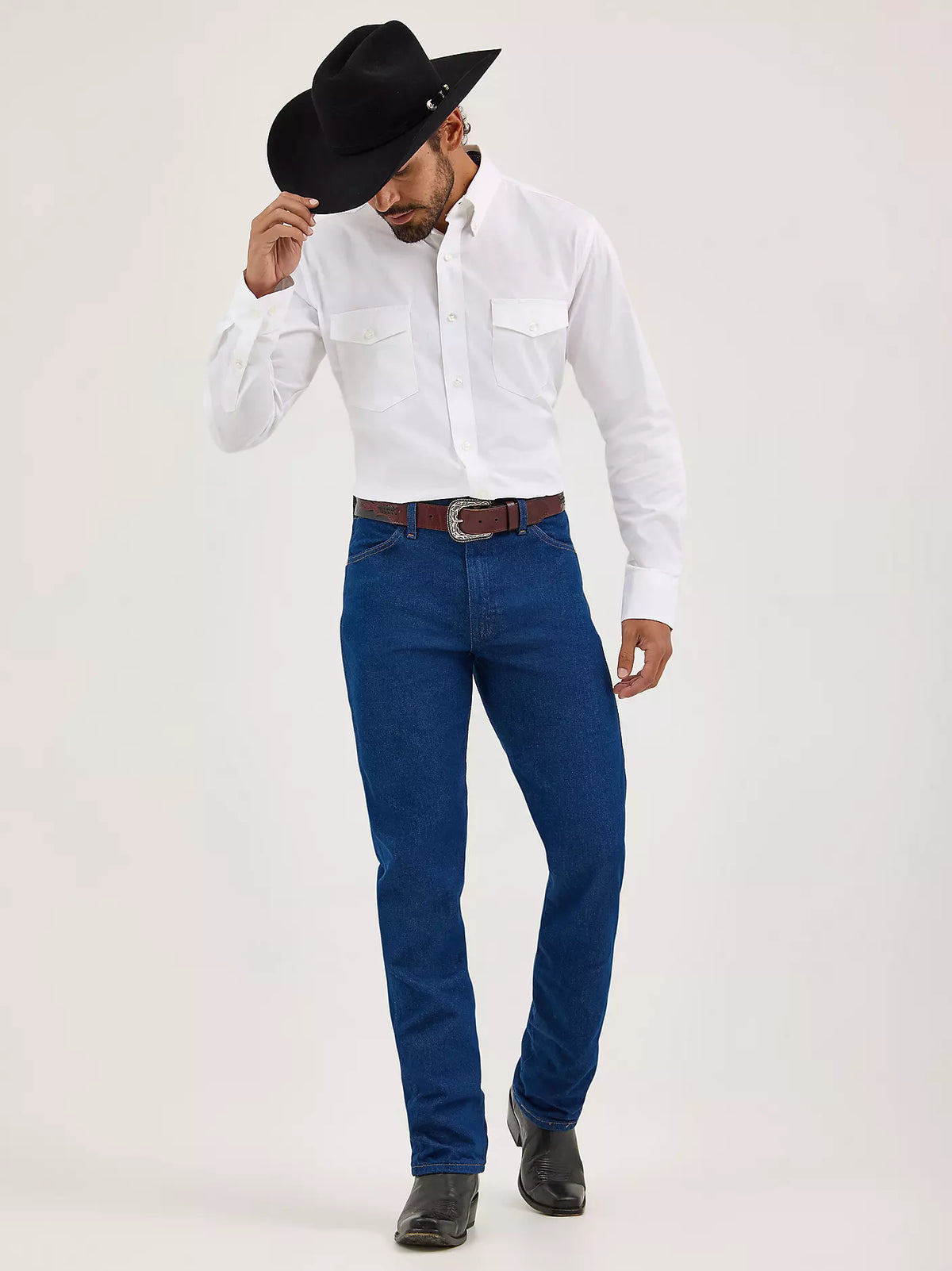 Wrangler Men's Cowboy Cut Original Fit jeans in prewashed indigo denim, showing classic cowboy style and sturdy construction.