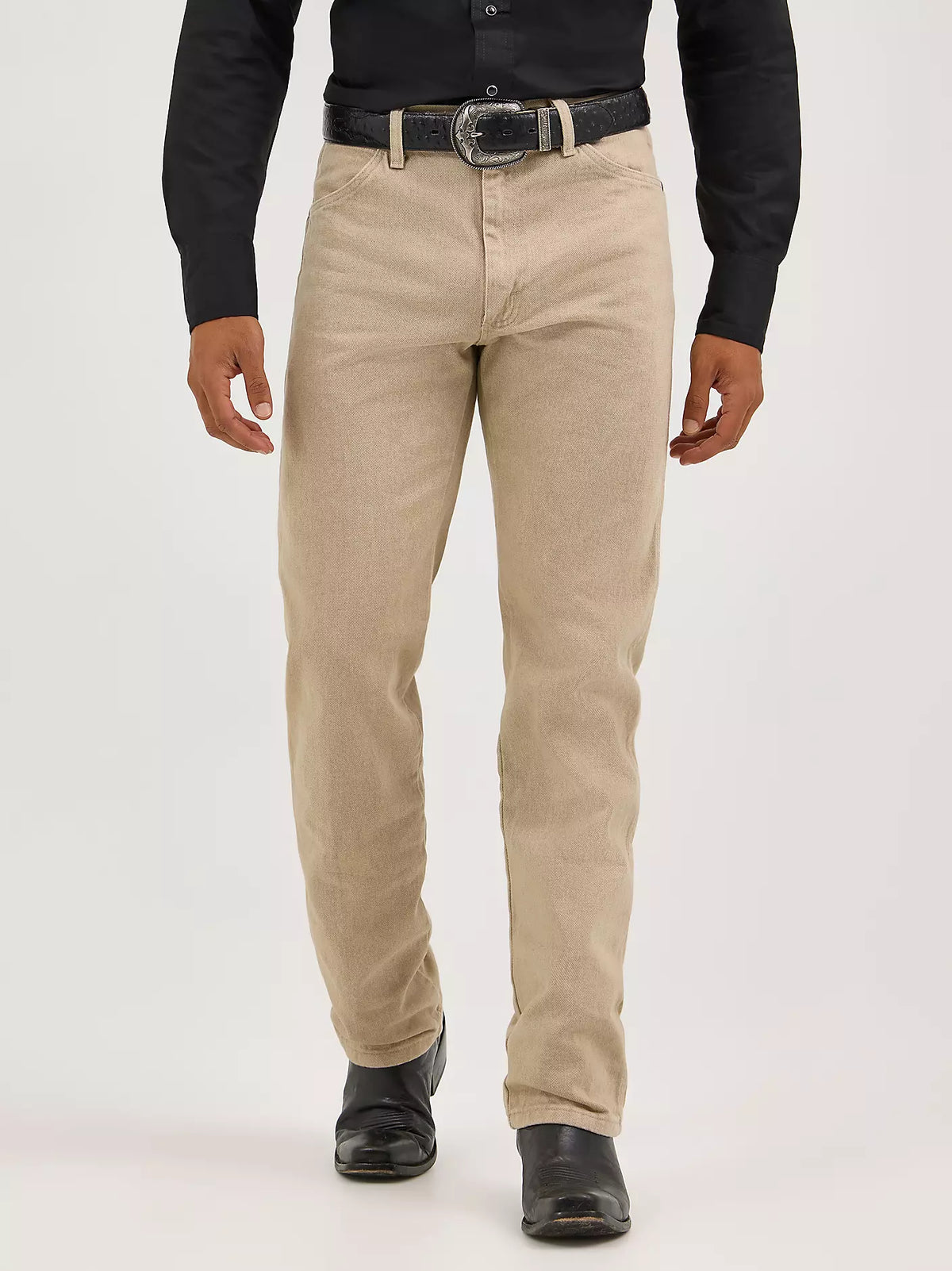 Wrangler Men's Cowboy Cut Original Fit prewashed indigo jeans with a classic tan color and rugged denim texture.