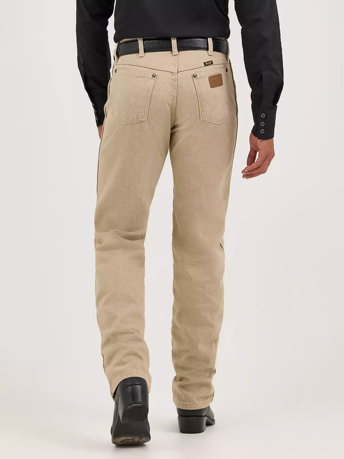 Wrangler Men's Cowboy Cut Original Fit jeans in prewashed tan denim, showcasing classic Western-style design and durable fabric.