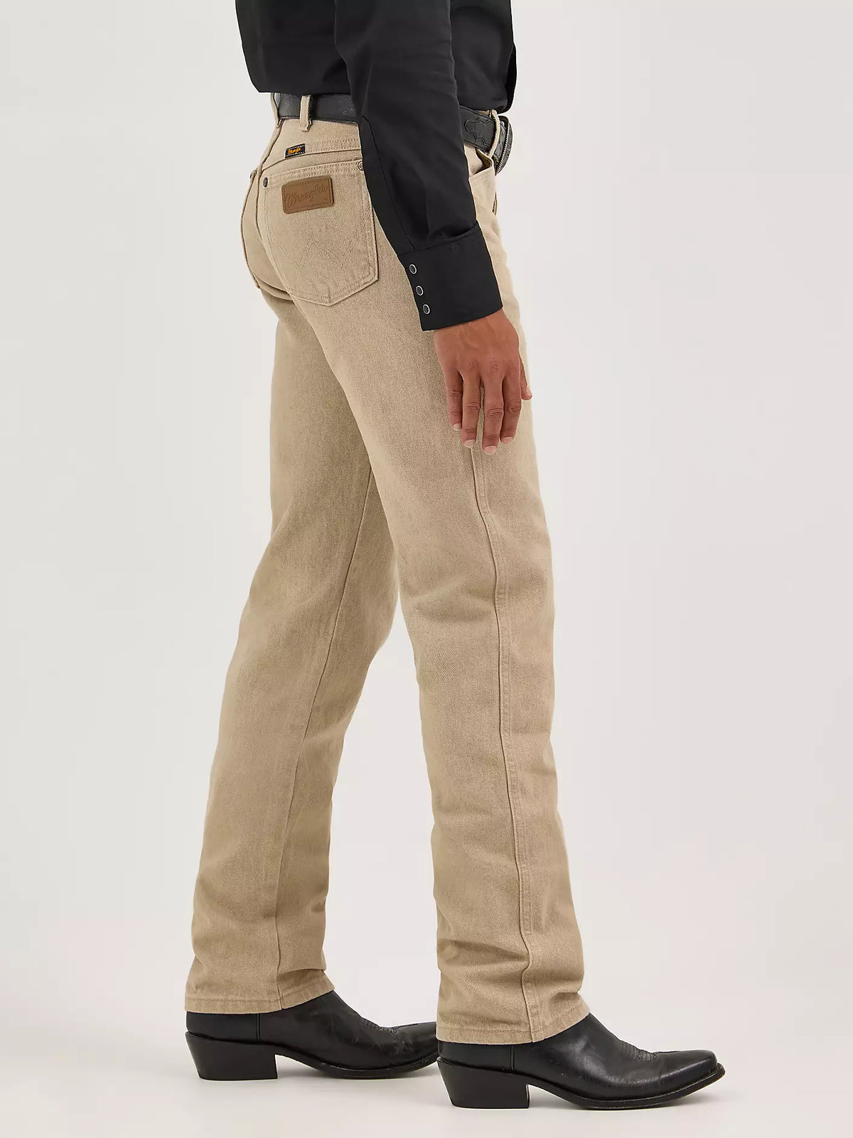 Wrangler Men's Cowboy Cut Original Fit prewashed tan jeans, showcasing classic Western style and durable denim fabric.