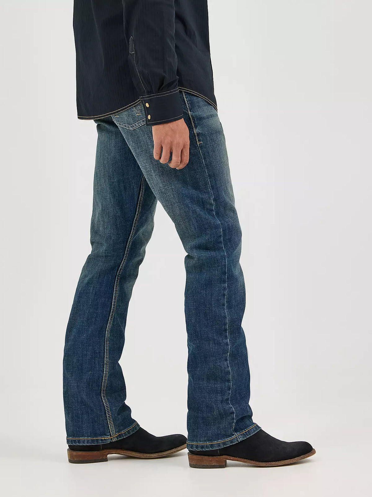 Wrangler Men's Retro Slim Boot Jean in Layton fit, dark denim with classic five-pocket design and authentic stitching.