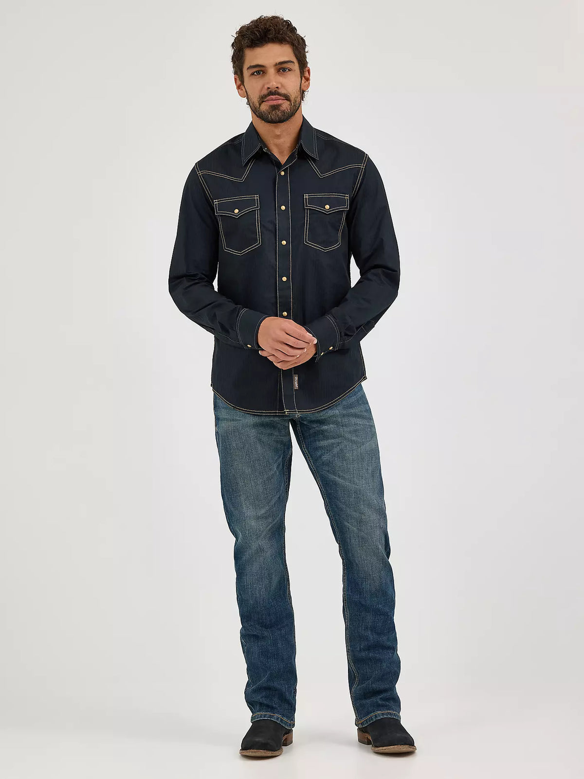 Wrangler Men's Retro Slim Boot Jean in Layton style, showing classic denim fabric and slim fit design with boot cut silhouette.
