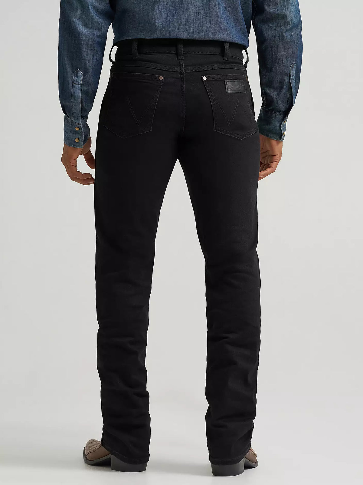 Wrangler Men's Retro Slim Straight Jeans in Blackwell color, denim fabric, featuring classic five-pocket design and belt loops.