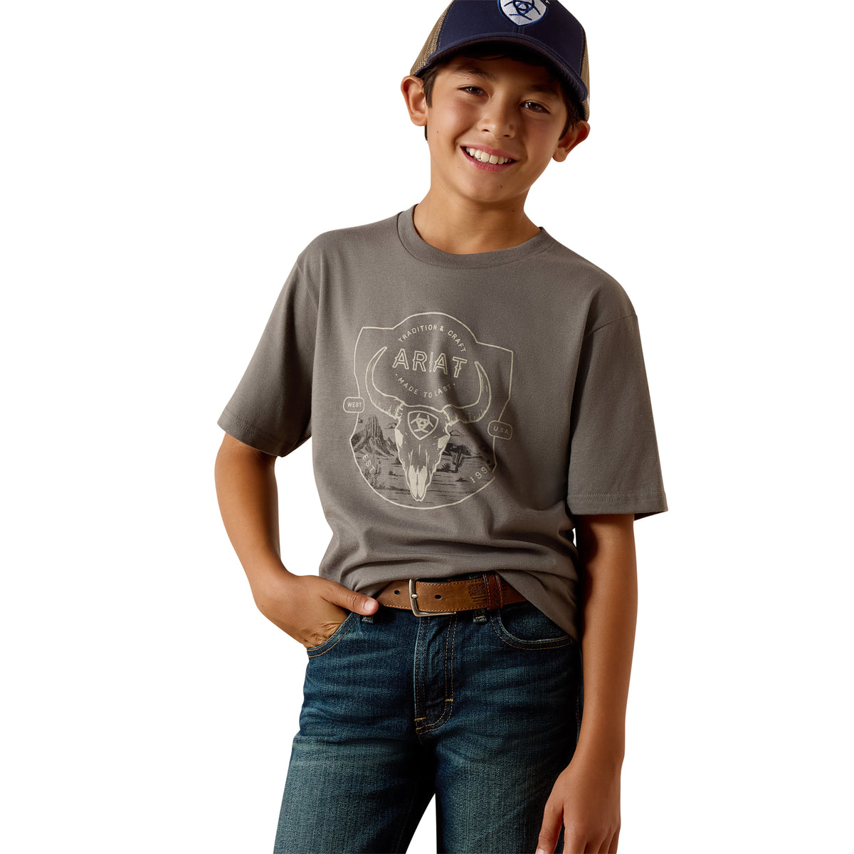 Youth Ariat Desert Badge Tradition T-Shirt in smoked pearl, featuring a graphic design on soft, comfortable cotton fabric.